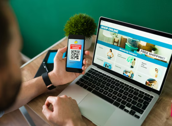 young-man-using-discount-coupon-his-smartphone-some-online-shopping
